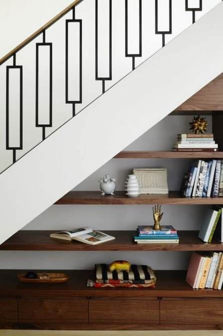 book shelves under the stairs